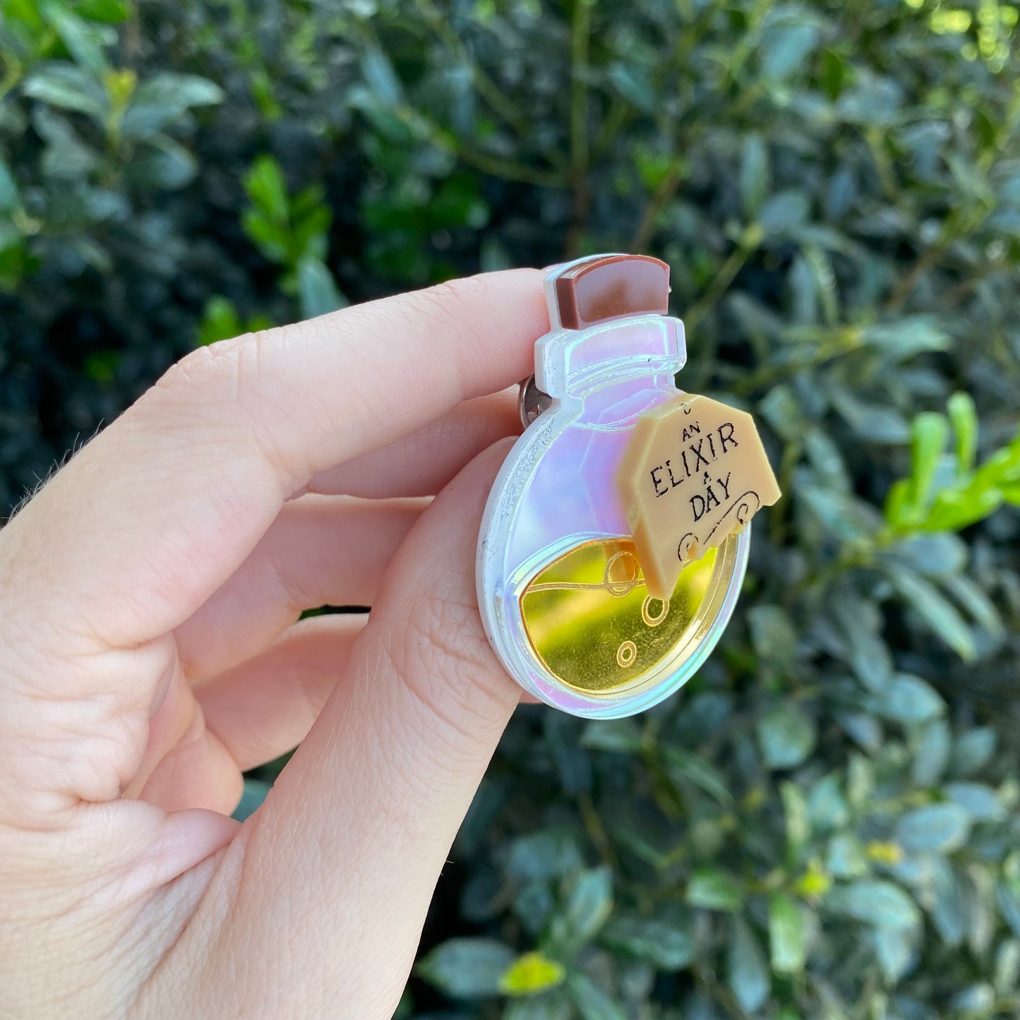 A Golden Elixer a Day Acrylic Pin